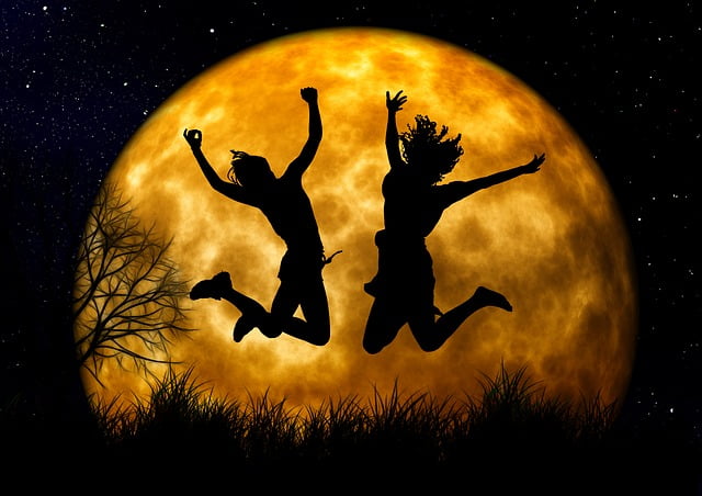 A-joyfull-picture-captured-where-who-person-jumping-in-front-of-big-moon